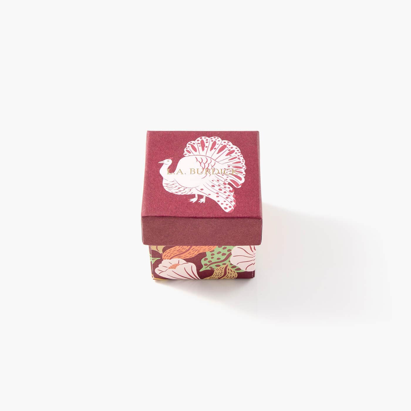 Our turkey favor box, festive and red with an illustrated turkey on the top of the gift box.